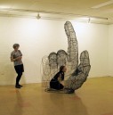 a see-through sculpture of a big hand